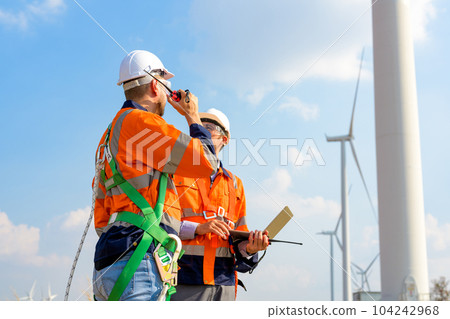 Renewable energy engineer working on wind turbine 104242968