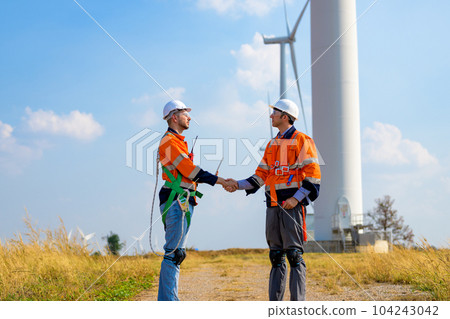 Renewable energy engineer working on wind turbine Renewable energy engineer working on wind turbine 104243042
