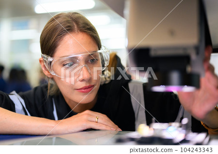 Quality control engineer specialist checking and inspecting circuit board 104243343