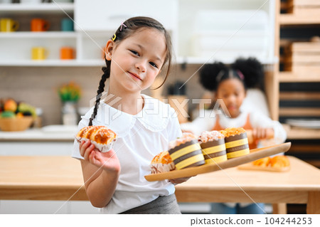 Children making bread in kitchen, Kids learning kitchen skill Children making bread in kitchen, Kids learning kitchen skill 104244253