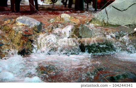 Water flowing over river rocks near mountains in Nathia Gali, Abbottabad, Pakistan. Water flowing over river rocks near mountains in Nathia Gali, Abbottabad, Pakistan. 104244341