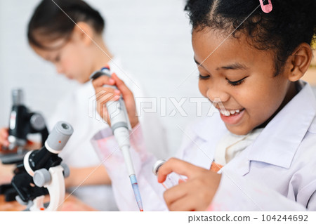 Child in classroom at school, Kid dressed science lab coat, Science concept 104244692