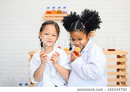 Child in classroom at school, Kid dressed science lab coat, Science concept 104244780