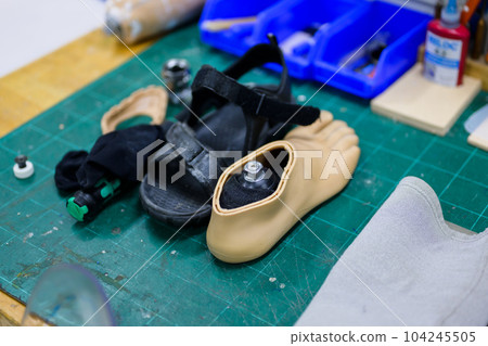 Silicon or plaster casts with tools in prosthetic production factory 104245505