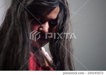 Scary woman in white dress with bloodstain after murder, Halloween concept 104245672