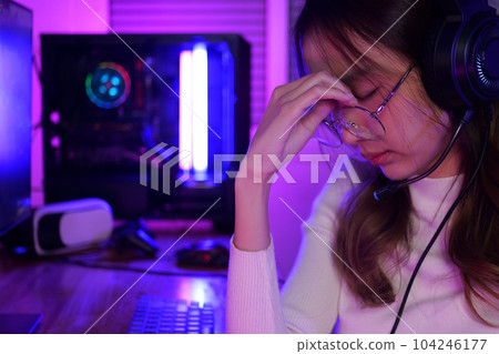 Female gamer having eye strain and headache after lose game Female gamer having eye strain and headache after lose game 104246177