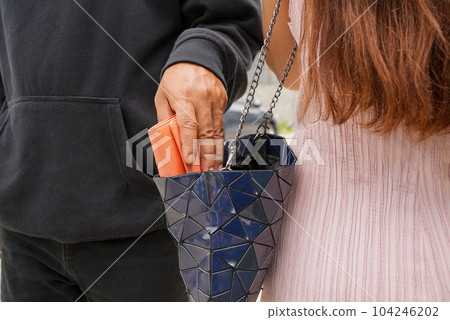 Man robbed woman, Thief stealing in public 104246202