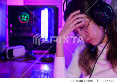 Female gamer having eye strain and headache after lose game 104246208
