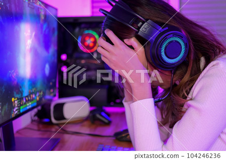 Female gamer having eye strain and headache after lose game Female gamer having eye strain and headache after lose game 104246236