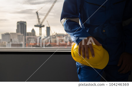 Engineer at building construction site, Safety first equipment Engineer at building construction site, Safety first equipment 104246369