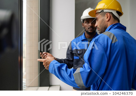 Professional construction engineers team using blueprint of project plan Professional construction engineers team using blueprint of project plan 104246370
