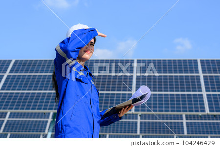 Engineer worker portrait with solar panel at solar farm Engineer worker portrait with solar panel at solar farm 104246429