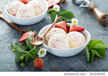 Strawberry ice cream in white bowls Strawberry ice cream in white bowls 104246495