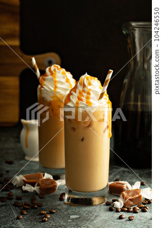 Caramel iced latte with whipped cream 104246550