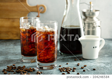 Cold brew iced coffee in tall glasses Cold brew iced coffee in tall glasses 104246584