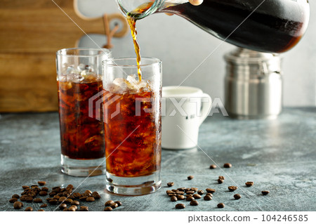 Cold brew iced coffee in tall glasses 104246585