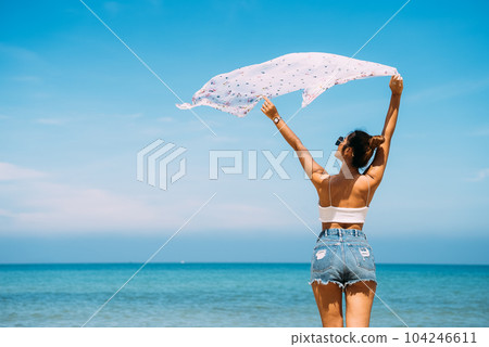 Back view of sexy body woman on paradise tropical beach 104246611