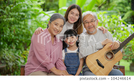 Happy family portrait, Senior grandparents with daughter and grandchild at home Happy family portrait, Senior grandparents with daughter and grandchild at home 104246614