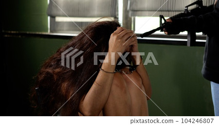 Unknown terrorist or murderer holding gun pointed to the head of unknown victim Unknown terrorist or murderer holding gun pointed to the head of unknown victim 104246807