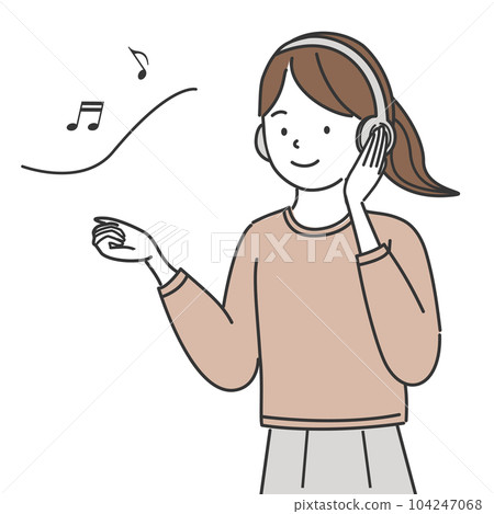 A woman listening to music with headphones 104247068