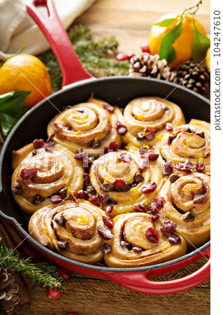 Orange and cranberry cinnamon rolls 104247610