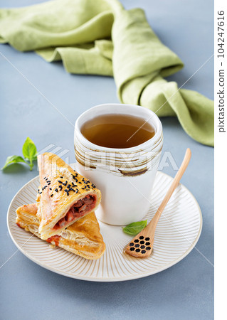 Red bean puff pastry with green tea Red bean puff pastry with green tea 104247616