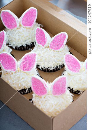 Easter chocolate cupcakes with bunny ears 104247619