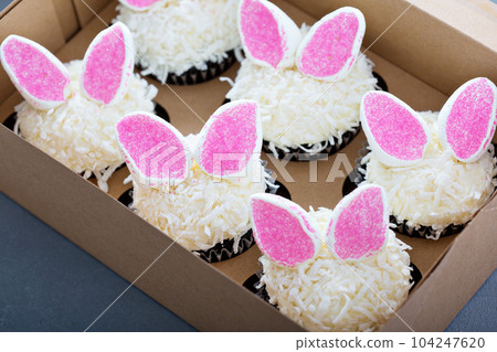Easter chocolate cupcakes with bunny ears 104247620