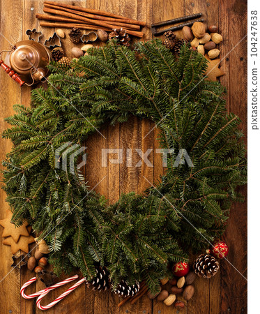 Evergreen Christmas wreath overhead view Evergreen Christmas wreath overhead view 104247638