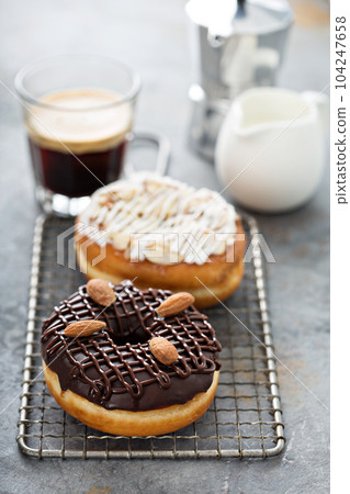 Chocolate and almond donuts with coffee 104247658