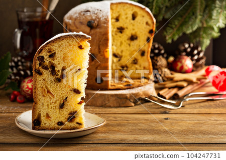 Traditional Christmas panettone with dried fruits Traditional Christmas panettone with dried fruits 104247731