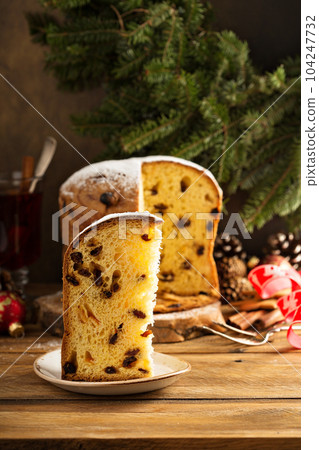 Traditional Christmas panettone with dried fruits Traditional Christmas panettone with dried fruits 104247732