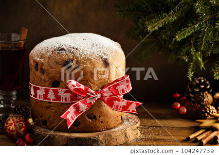 Traditional Christmas panettone with dried fruits Traditional Christmas panettone with dried fruits 104247739
