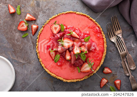 Yogurt tart with rhubarb strawberry compote 104247826