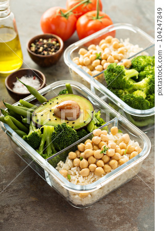 Vegan meal prep containers with cooked rice and chickpeas Vegan meal prep containers with cooked rice and chickpeas 104247849