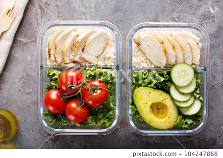 Healthy meal prep containers with chicken and rice 104247868