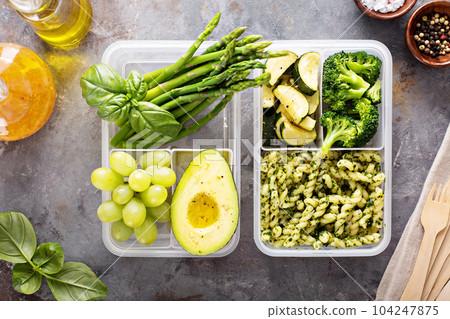 Vegan meal prep containers with pasta and vegetables 104247875
