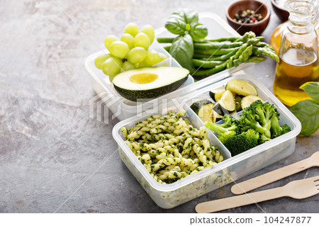 Vegan meal prep containers with pasta and vegetables 104247877