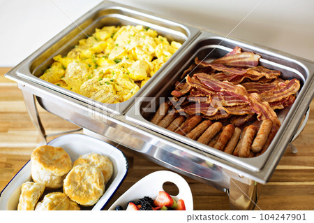 Breakfast buffet with scrambled eggs and bacon Breakfast buffet with scrambled eggs and bacon 104247901