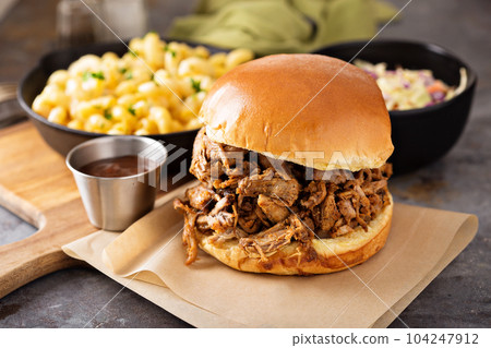 Pulled pork sandwich with bbq sauce Pulled pork sandwich with bbq sauce 104247912
