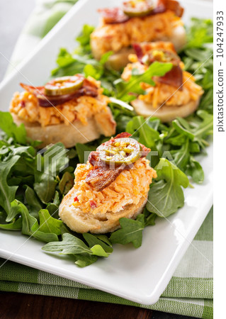 Pimento cheese bruschetta with bacon 104247933