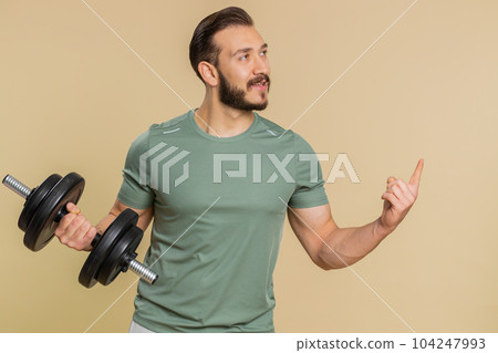 Athlete man pointing empty place advertising area for commercial text copy space for goods promotion Athlete man pointing empty place advertising area for commercial text copy space for goods promotion 104247993