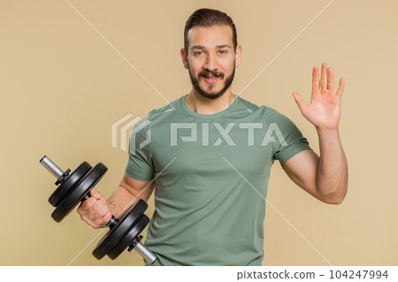 Athlete sportive man showing inviting gesture hello with hands, ask to join, welcome, come, join us 104247994