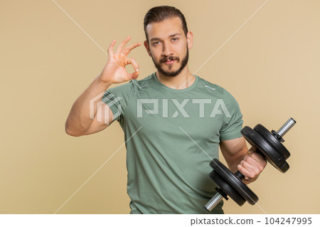 Athlete sportive man looking at camera showing ok gesture, like sign positive, feedback, celebrate Athlete sportive man looking at camera showing ok gesture, like sign positive, feedback, celebrate 104247995
