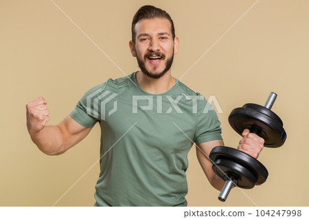 Excited sportive man surprised, shocked by sudden victory, good win news, celebrating, wow reaction Excited sportive man surprised, shocked by sudden victory, good win news, celebrating, wow reaction 104247998