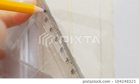 Marking places with a pencil forInstallation of a socket Marking places with a pencil forInstallation of a socket 104248323