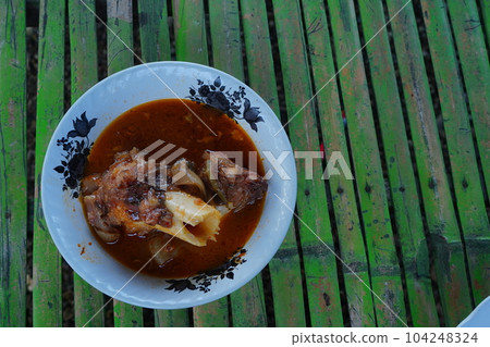 Spicy Foot cow soup is the Indonesian food especially in Madura Island Spicy Foot cow soup is the Indonesian food especially in Madura Island 104248324