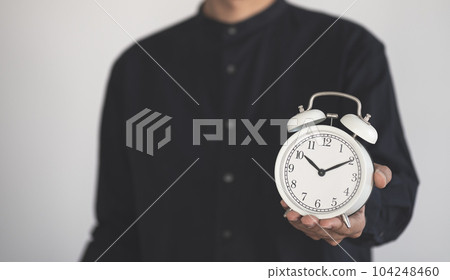 Time managment concept. Business man hold the clock . Work management. 104248460