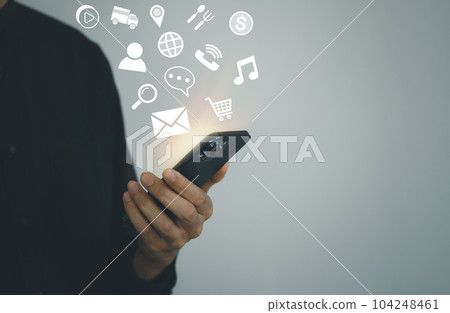 Business man touch the screen on smart phone with emotion icons. social network and social media marketing concept. Business man touch the screen on smart phone with emotion icons. social network and social media marketing concept. 104248461
