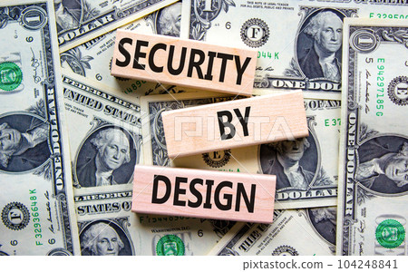 Security by design symbol. Concept words Security by design on wooden blocks on a beautiful background from dollar bills. Business finacial security by design concept. Copy space. 104248841